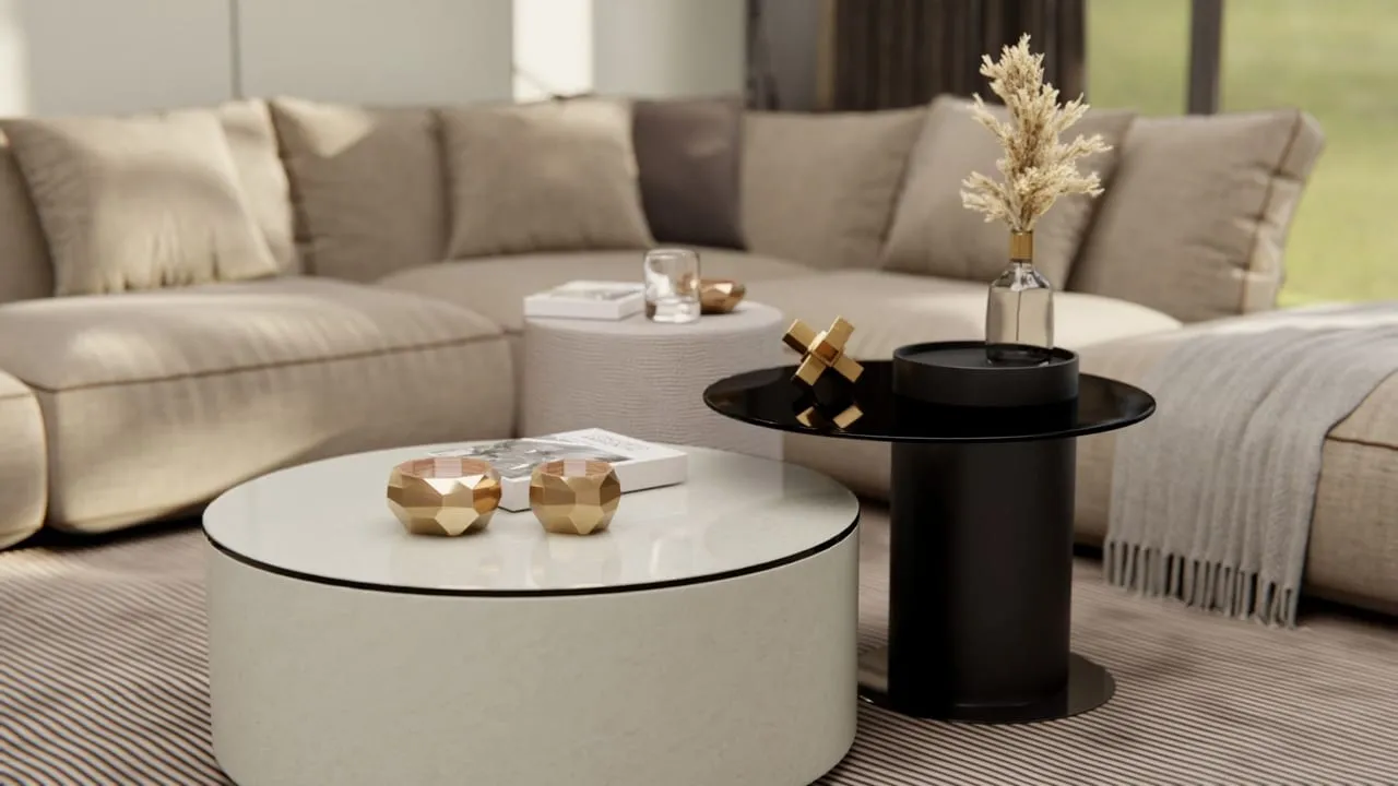 Visuel Cover Styl' : table basse ronde effet marbre crème devant un canapé d'angle beige